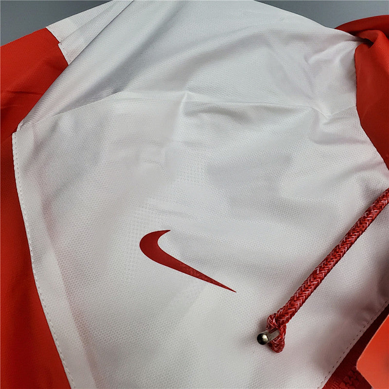Coupe-vent International redwhite 20/21